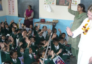 Performing a concert for schoolchildren in India as part of Harriet's outreach beliefs and committments.